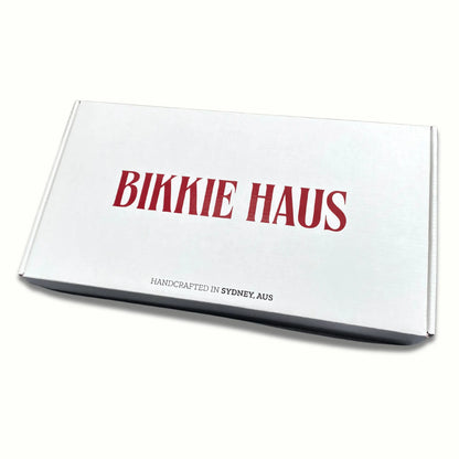 Closed Bikkie Haus box, with the big red logo and handcrafted in Sydney, AUS underneath. 